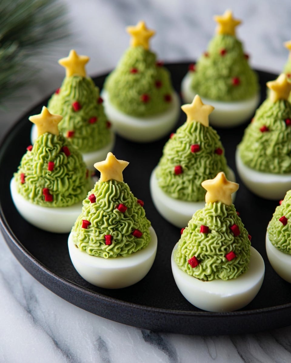 There are eight white boiled egg halves placed on a black round plate on a white marbled surface. Each egg half has a tall, green creamy filling that looks like a textured swirl, shaped like a Christmas tree. Small red pieces are scattered in the green swirl to look like decorations. On the top of each green swirl, there is a small yellow star-shaped piece, resembling a star on a Christmas tree. The whole display looks neat and festive. photo taken with an iphone --ar 4:5 --v 7