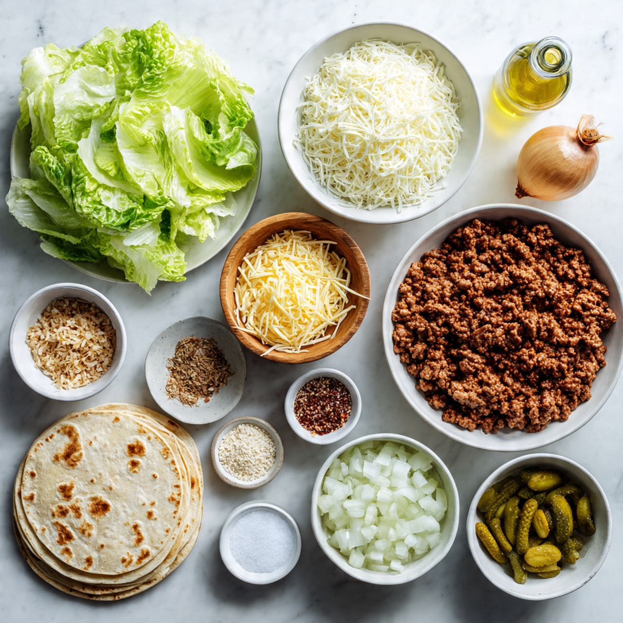 The image shows an overhead view of various ingredients neatly arranged on a white marbled surface. At the top left, there is a white plate filled with fresh, crisp lettuce leaves in shades of green. To its right, a white bowl contains finely shredded white cheese, and next to it sits a whole white onion and a small bottle of oil. Below these, a larger white bowl holds cooked ground beef with a crumbly texture. In the middle, a small wooden bowl is filled with shredded yellow cheese, and near it, two small white bowls contain different seasonings, one with sesame seeds and the other with salt. To the left, there is a white plate stacked with rice paper sheets. At the bottom center, a white bowl contains diced onions, and to the right, another white bowl is filled with small pickles. Additional seasonings in small white bowls complete the arrangement. The photo taken with an iphone --ar 4:5 --v 7