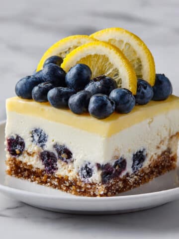 Lemon Blueberry Ricotta Cheesecake with Vanilla Wafer Crust and Lemon Curd Garnish Recipe