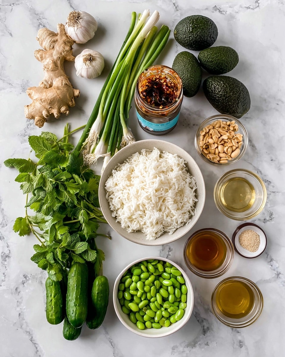 The image shows fresh ingredients laid out on a white marbled surface. At the center bottom is a white bowl filled with fluffy white rice. Above and slightly to the right, there is a small white bowl of bright green edamame. To the right of the rice bowl are small glass bowls filled with light brown sauce, clear liquid, and golden oil. Above the rice bowl is an open jar of crunchy chili onion sauce, with a small glass bowl of light brown peanuts beside it. To the left of the chili jar, there are bunches of fresh green herbs including cilantro and mint. At the top left corner of the image is a piece of fresh ginger and a bulb of garlic. Next to these are two whole dark green avocados and a bunch of green onions secured with a blue band. On the right side near the top are four small dark green cucumbers arranged neatly. photo taken with an iphone --ar 4:5 --v 7