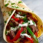 Sizzling Steak Fajitas with Colorful Bell Peppers and Onions Recipe