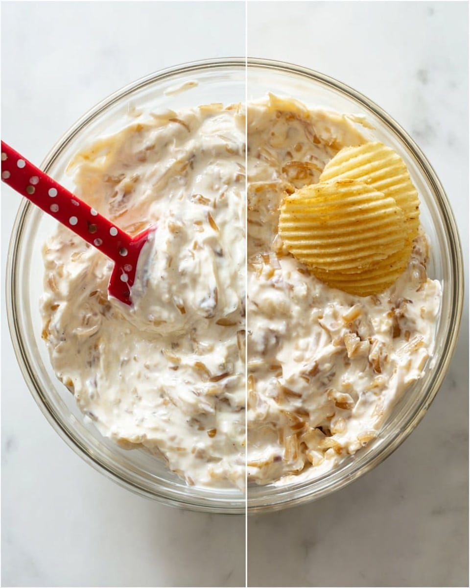 A clear glass bowl filled with a creamy white dip mixed with small chunks of light brown cooked onions evenly spread throughout. In the first view, a red spatula with white dots is partially dipped into the dip, showing the creamy thick texture. In the second view, a single ridged potato chip is placed on the top right side, partially submerged in the dip. The bowl sits on a white marbled surface, bright and clean. Photo taken with an iphone --ar 4:5 --v 7
