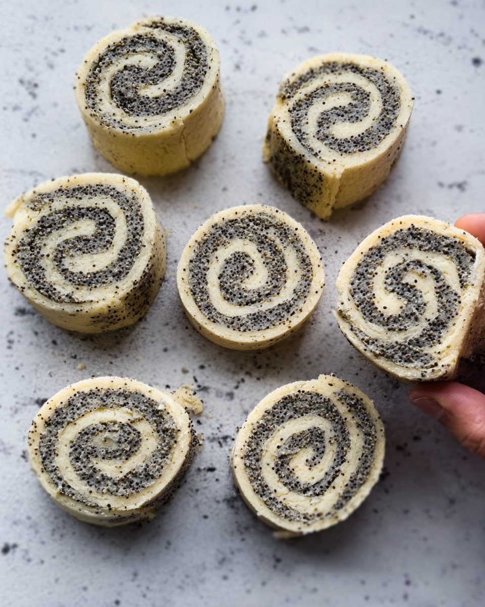 The image shows six spiral-shaped dough pieces arranged on a white marbled surface. Each piece has two visible layers: a lighter beige dough layer on the outside and a darker speckled filling rolled evenly inside, creating tight spirals. The dough texture looks soft and slightly fluffy, while the filling appears grainy and textured. The pieces are casually placed, some touching each other, with a woman's hand holding one on the upper right edge of the image. Photo taken with an iphone --ar 4:5 --v 7