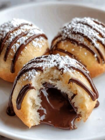 Nutella Bombs: Soft, Pillowy Dough Filled with Hazelnut Spread Coated in Powdered Sugar Recipe