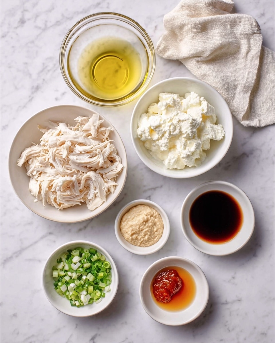 The image shows seven small white bowls arranged neatly on a white marbled surface. Starting from the top left, there is a clear glass bowl filled with a pale yellow liquid oil. Next to it on the right is a white bowl full of soft white cream cheese. Below these, on the left, is a white bowl with shredded white chicken. Next to it on the right is a smaller white bowl with a dark reddish-brown liquid soy sauce. At the bottom row, three small white bowls hold finely chopped green onions, orange-brown sauce, and a light beige minced garlic paste from left to right. A woman's hand is holding a cream colored cloth in the top right corner. photo taken with an iphone --ar 4:5 --v 7