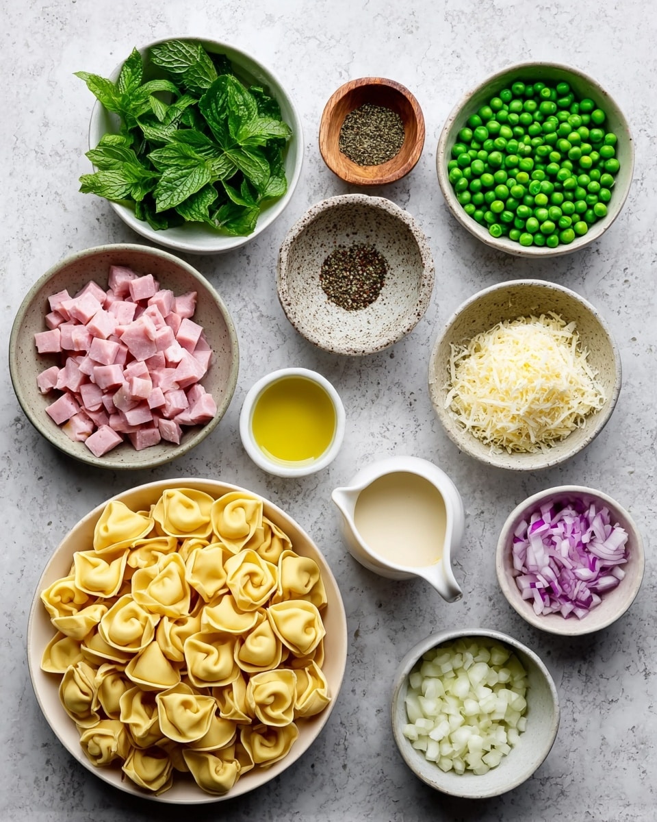 A collection of ingredients is arranged on a white marbled surface: starting from the top left, a white bowl holds fresh green mint leaves, below it a small wooden bowl contains ground black pepper, next is a speckled bowl filled with bright green peas. Moving to the center, a white bowl is packed with small pink diced ham pieces, above it is a small white bowl with grated pale yellow cheese. To the right side, a large white bowl has a pile of uncooked yellow tortellini pasta with visible folds and rings. Next to it, another white bowl contains chopped purple and white onion pieces. A small white cup filled with yellow olive oil and a small white bowl with chopped white garlic cloves are nearby. In the middle, below the ham is a tiny ceramic pitcher holding a creamy white sauce. Everything sits neatly spaced apart. Photo taken with an iphone --ar 4:5 --v 7