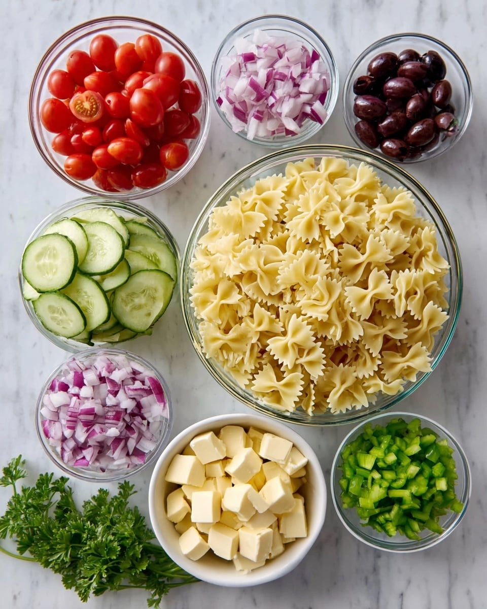 The image shows seven bowls arranged on a white marbled surface. On the top right is a large clear bowl filled with uncooked farfalle pasta, displaying its pale yellow color and bowtie shape. To the top left, there is a clear bowl filled with halved cherry tomatoes in red color. Below it to the left, a clear bowl with sliced cucumber rounds that are light green with white centers. In the center, a clear bowl contains small diced red onions with a purple and white mix. To the right middle, a smaller white bowl holds sliced black olives, dark purple in color. On the bottom left, a smaller white bowl is filled with small cubes of pale yellow cheese. Finally, next to it on the right side, a small white bowl contains chopped light green peppers, and fresh green parsley bunches lay in the bottom front. Photo taken with an iphone --ar 4:5 --v 7